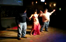 Authentic Belly Dancing Entertainment | Fort Worth, TX | Belly Dancer | Neenah teaching two Gentlemen how to Belly Dance at Stratos